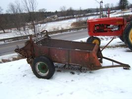 International Harvester model 100 manure spreader. Complete except for side chain covers. Needs work. $450.00